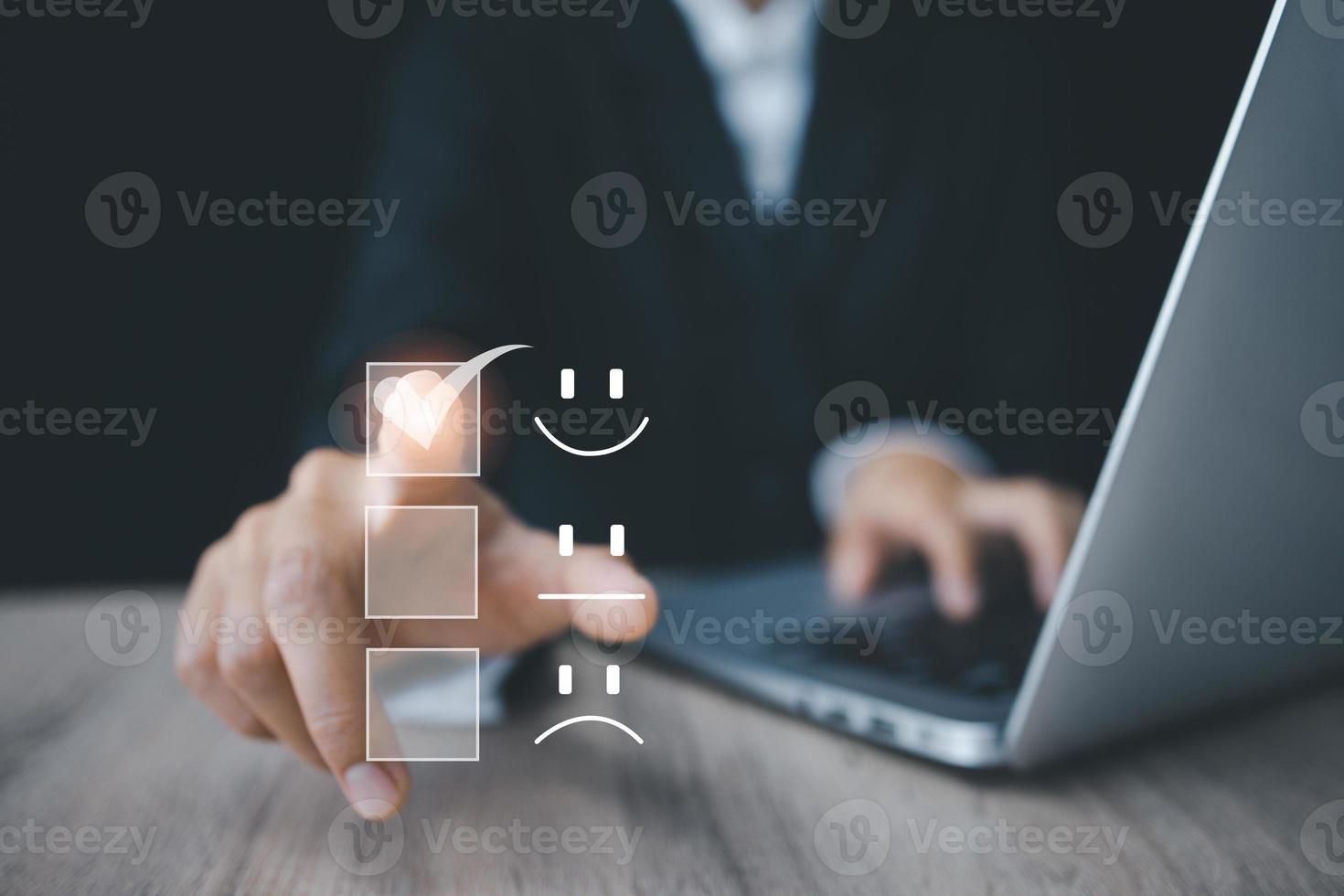 Customer service and Satisfaction concept, Business people touching the virtual screen on the happy Smile face icon to give satisfaction in service. photo