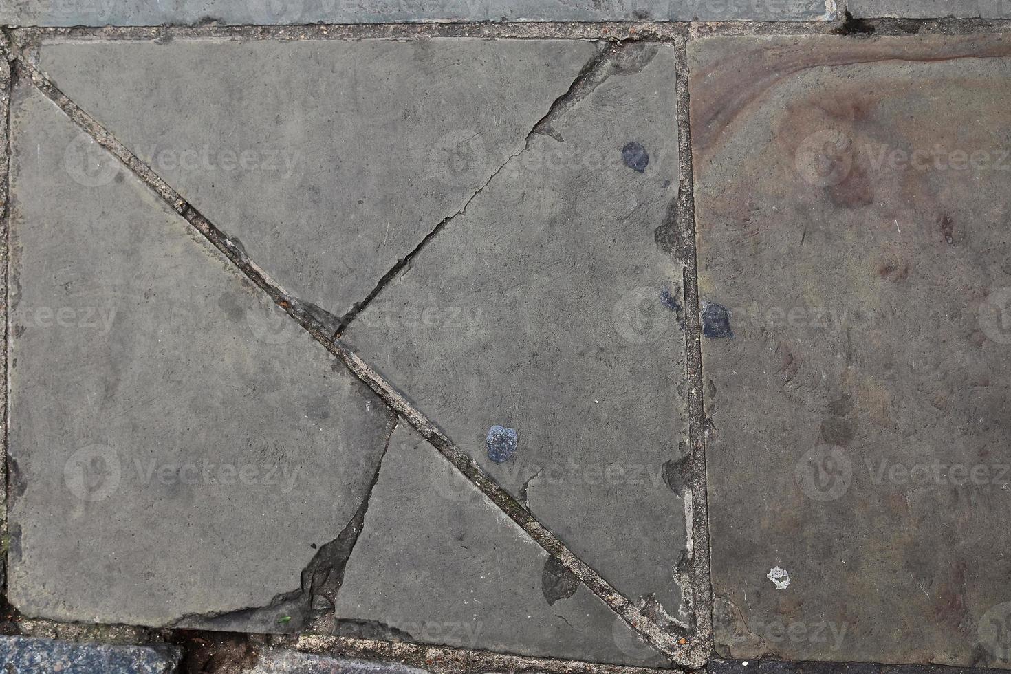 Detailed close up texture on structured floor tiles on the ground photo