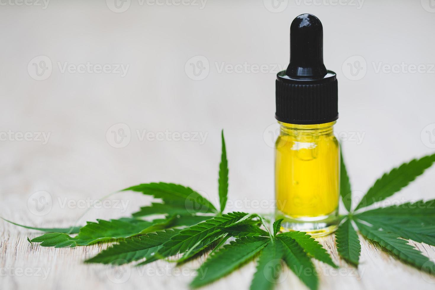 CBD hemp oil, Hemp oil extract in glass bottles, medical marijuana concept. photo