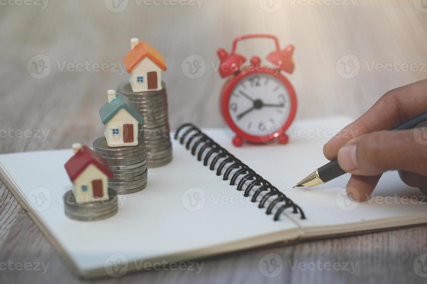 planning savings money of coins to buy a home, concept for property ladder, mortgage and real estate investment. for saving or investment for a house, growing business photo