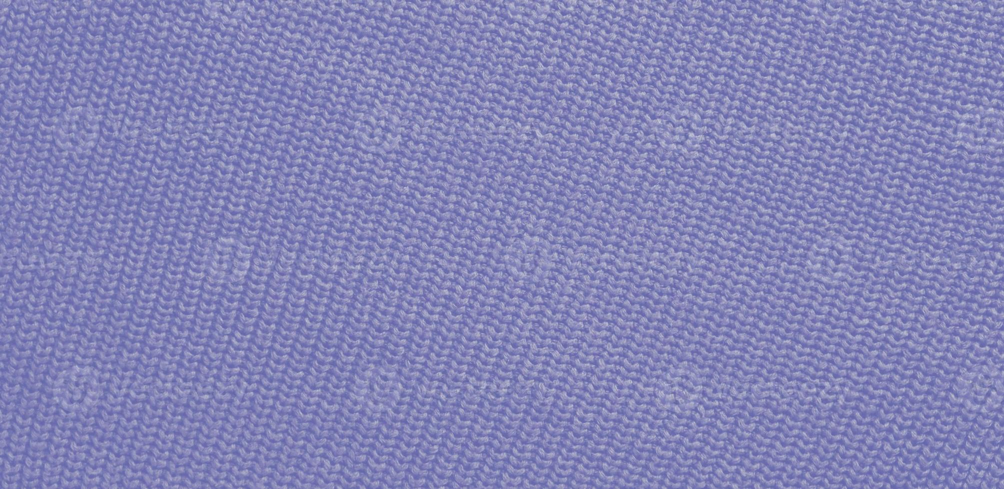 Texture of smooth knitted sweater with pattern. Handmade knitting wool or cotton fabric texture. Background of knitting patterns with vertical stripes. photo