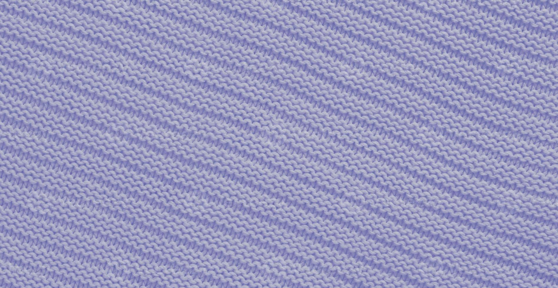 Texture of smooth knitted sweater with pattern. Handmade knitting wool or cotton fabric texture. Background of knitting patterns with horizontal stripes. photo