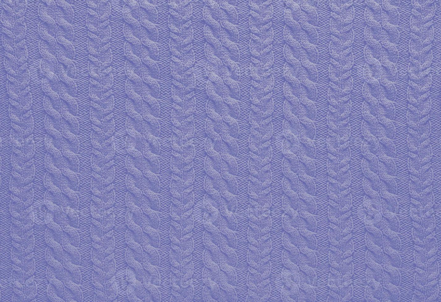 Texture of smooth knitted sweater with pattern. Handmade knitting wool or cotton fabric texture. Background of knitting patterns with a vertical Braid Cable. photo