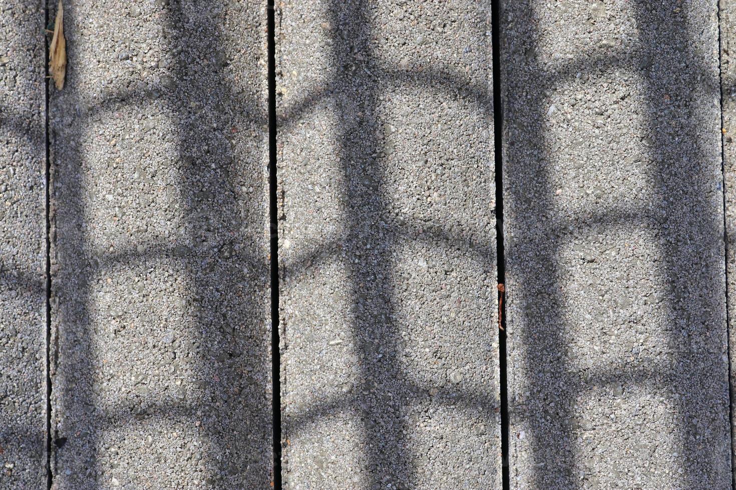 Detailed close up texture on structured floor tiles on the ground photo