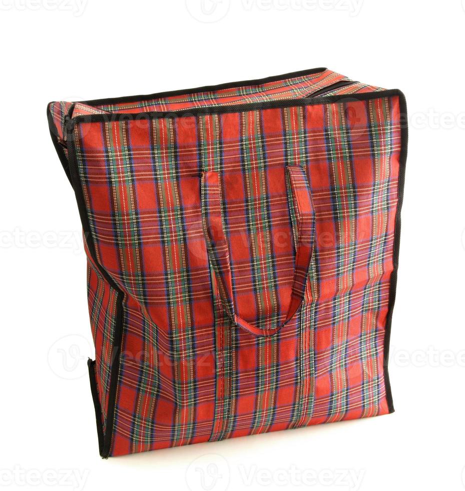 Red tartan bag isolated on white photo