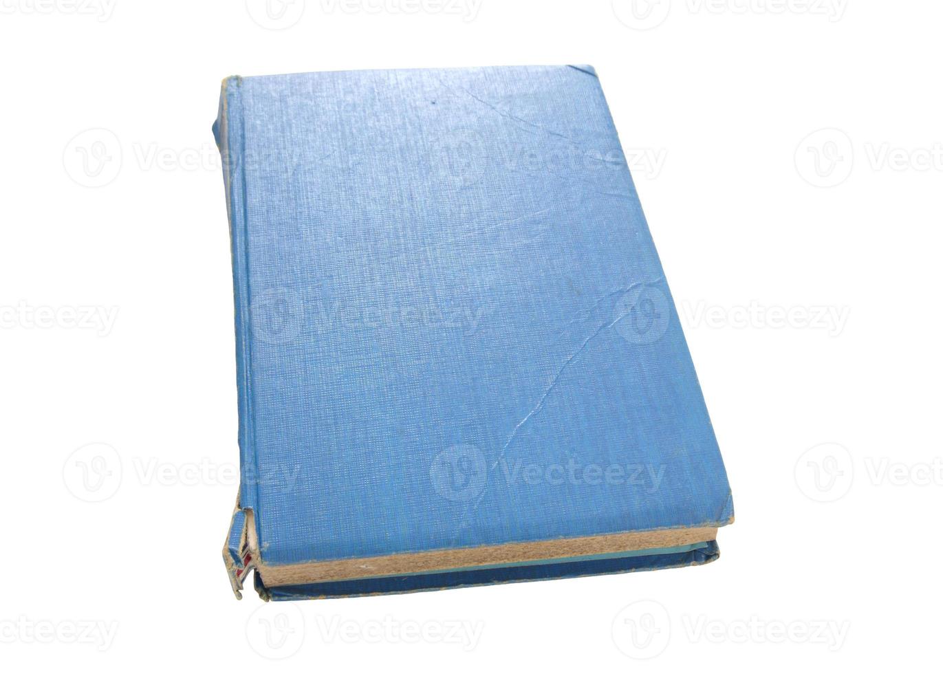 old blue book isolated on white background photo