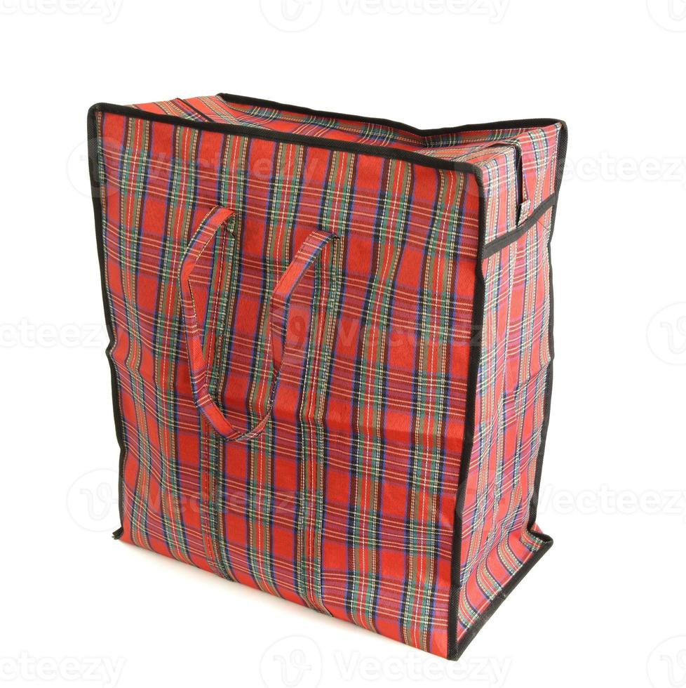 Red tartan bag isolated on white photo