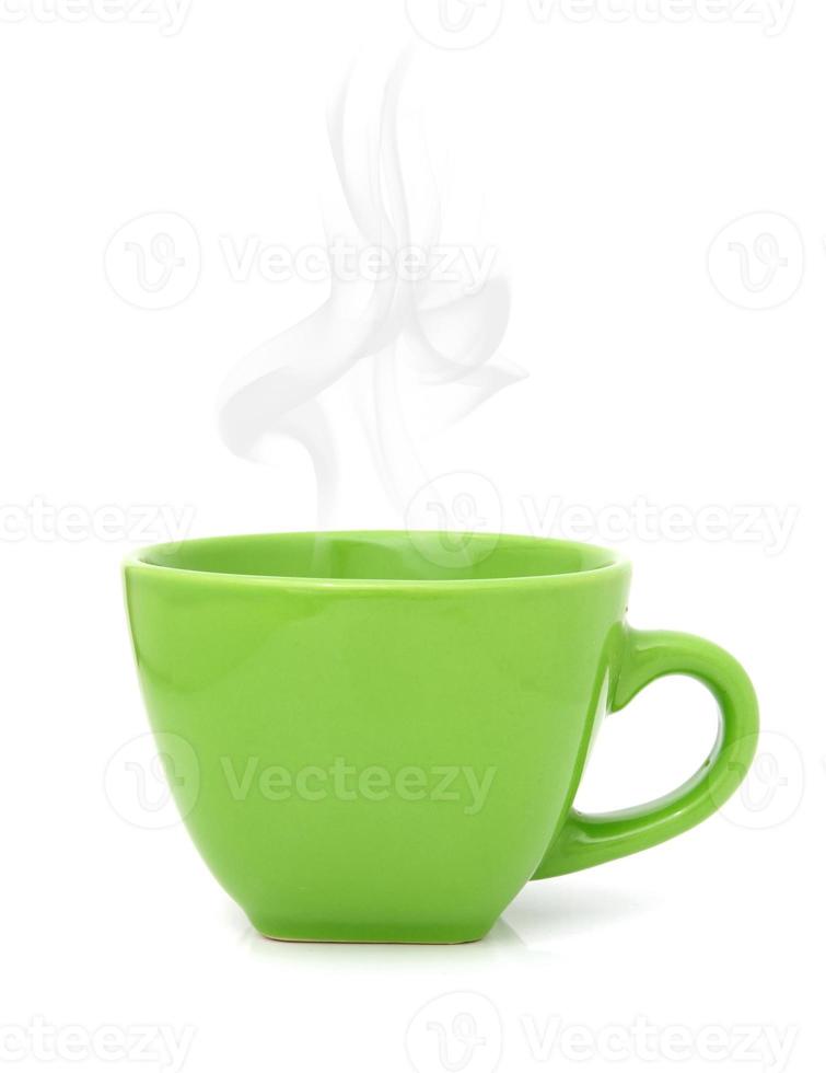 Green cup with hot drink on white background photo