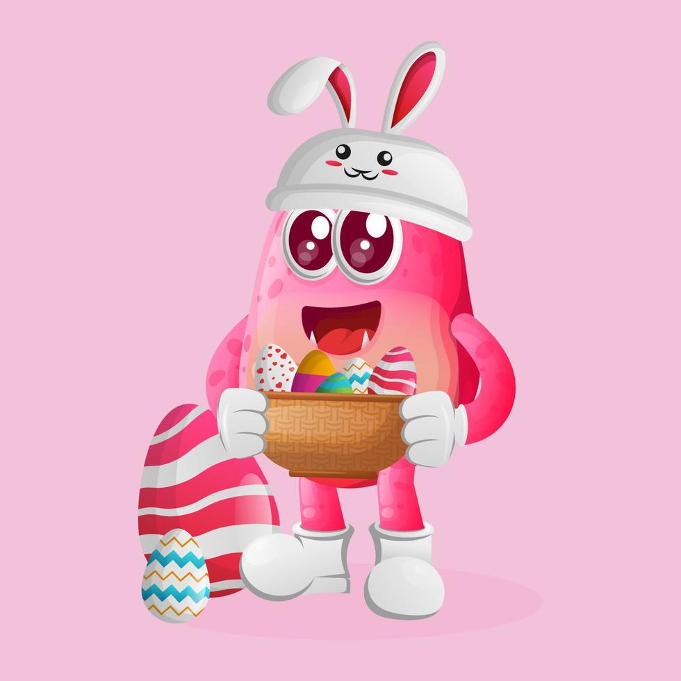 lindo monstruo rosa con la gorra de conejito sosteniendo un huevo de pascua en la canasta vector