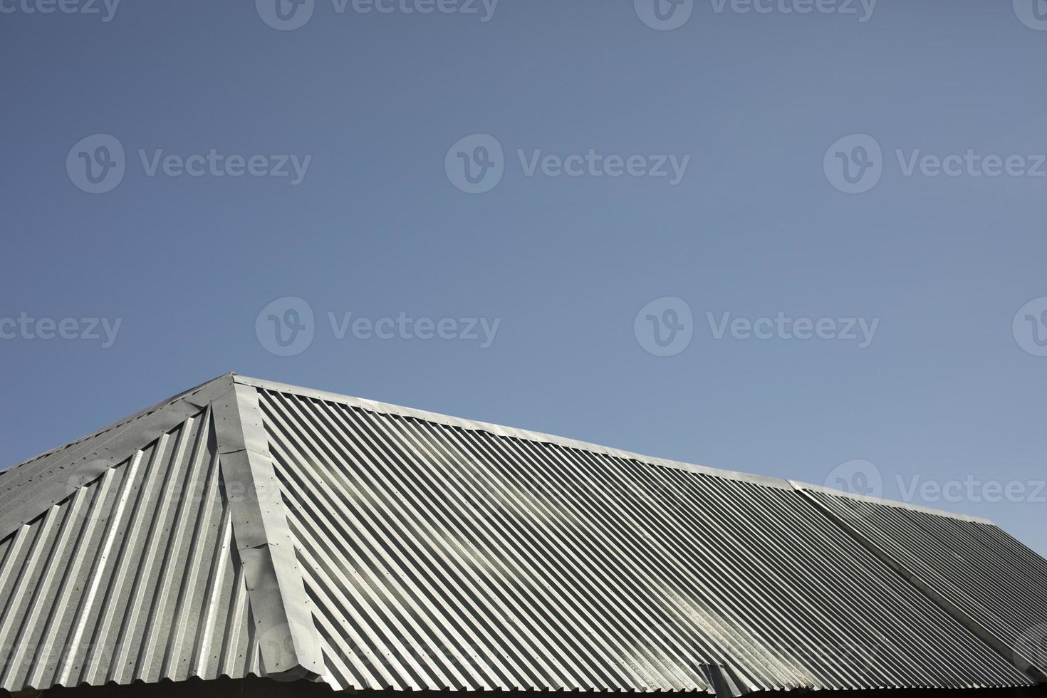 Roof is made of metal. Steel roof. Details of building. photo