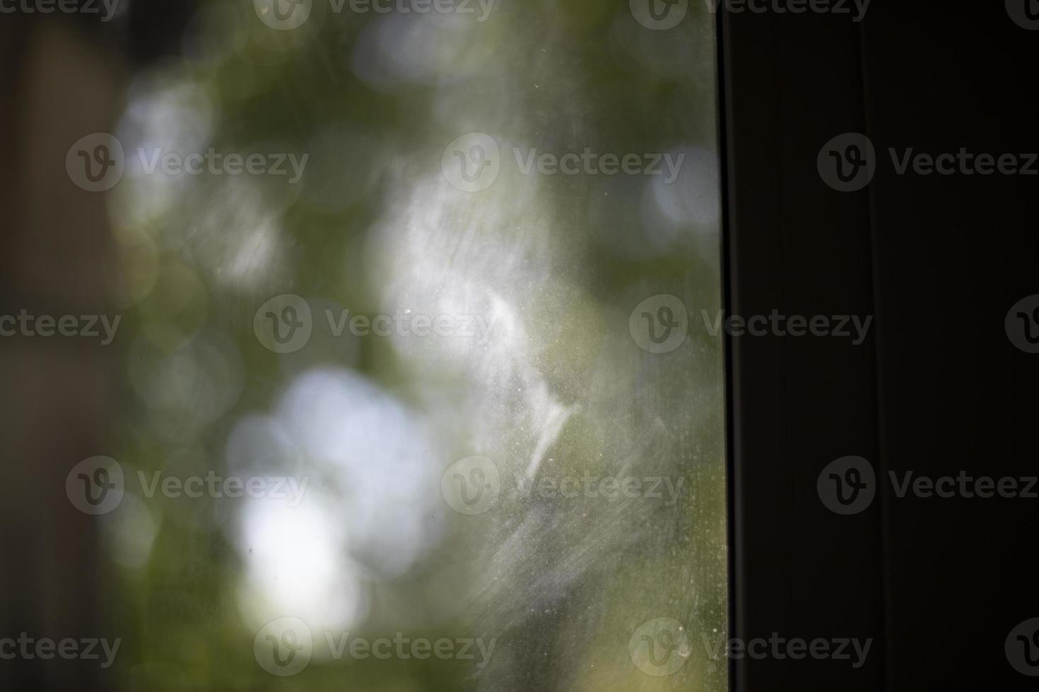 Reflection in glass. Dirty window. Dust on window glass. photo