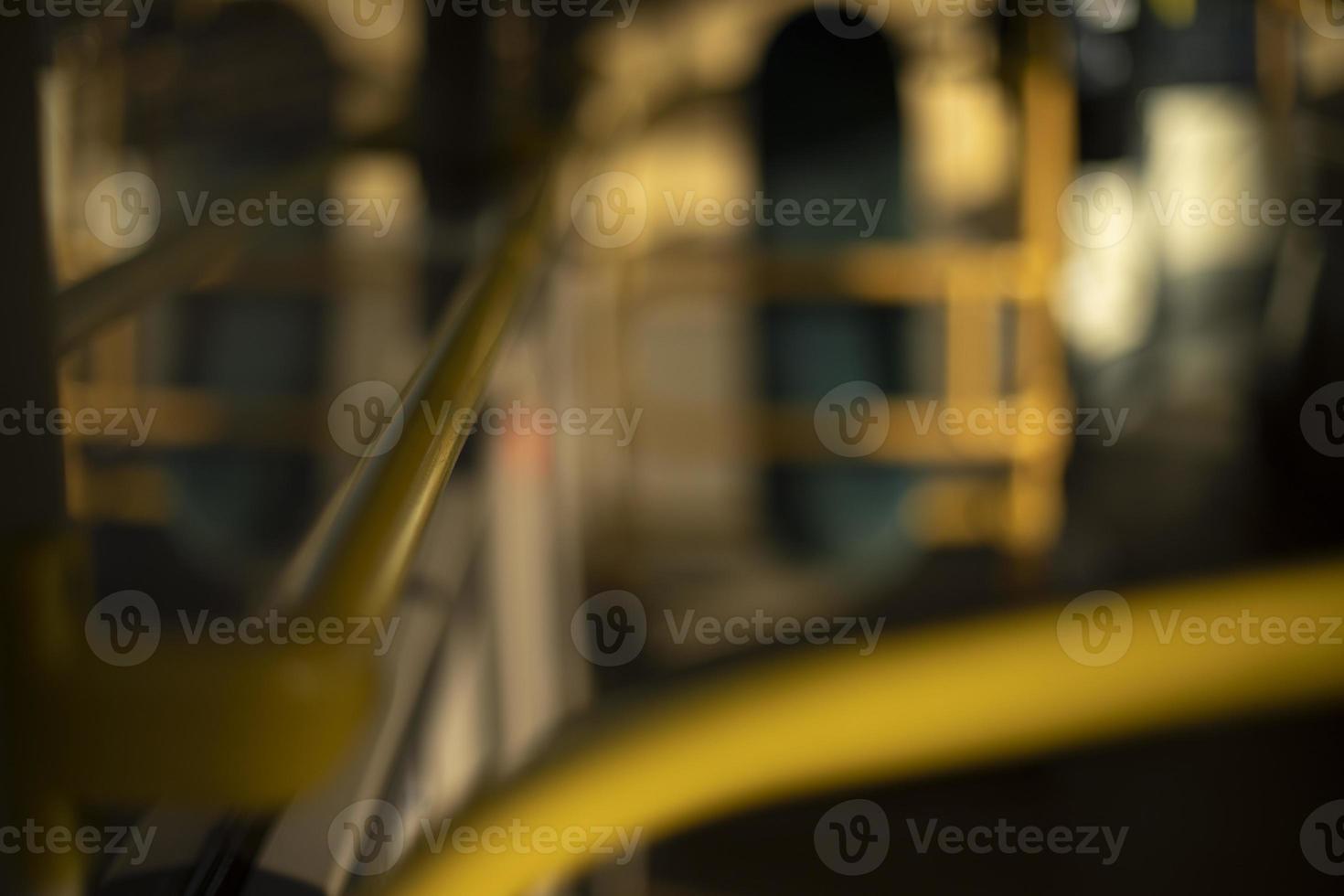 Interior of bus. Yellow handrail in transport. photo