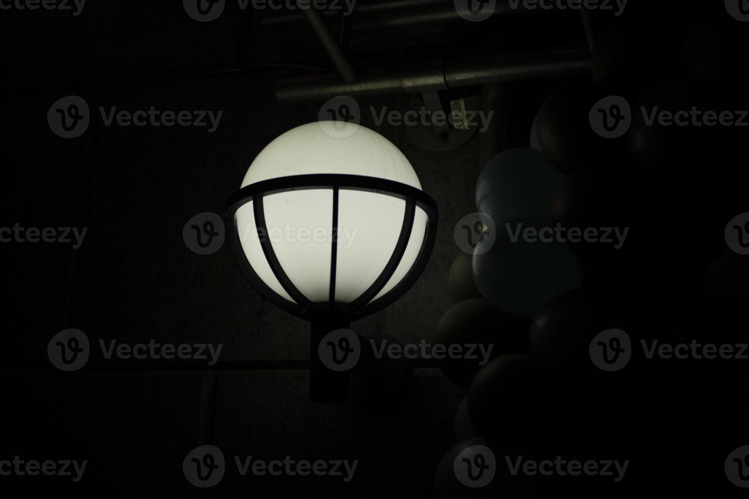 Lamp on street. Light in city. Round light source. photo