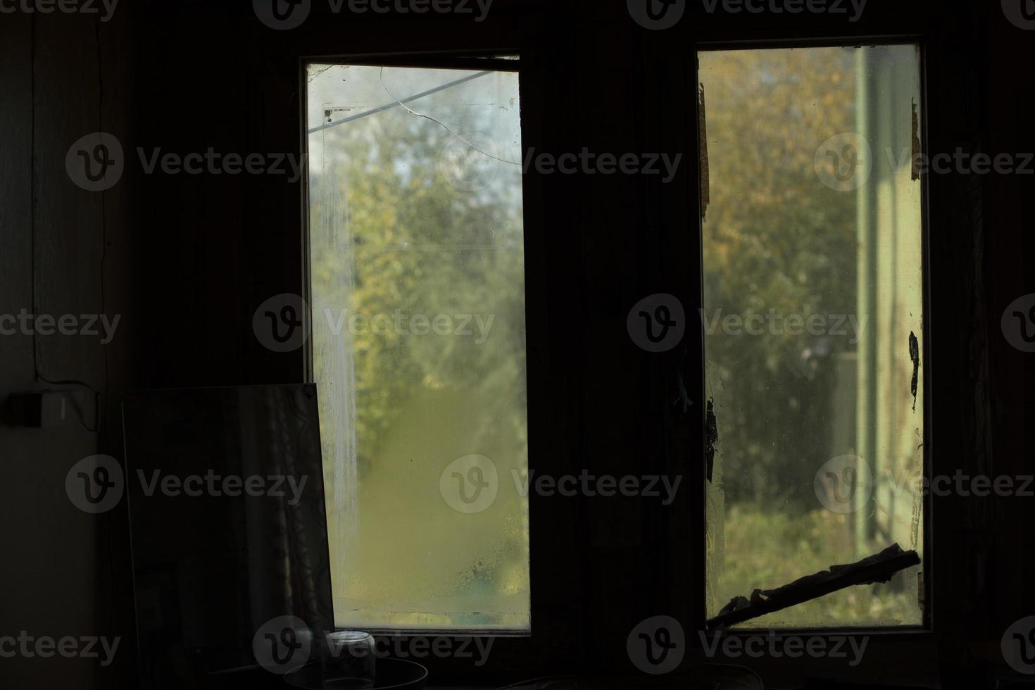 Dark window in room. Old window in interior. Details of room. photo