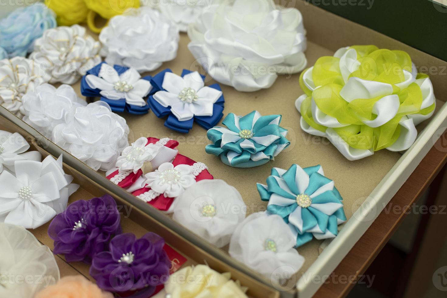 Fabric bows. Handmade hair clips. Flowers from fabric flaps. Hair ornament. photo