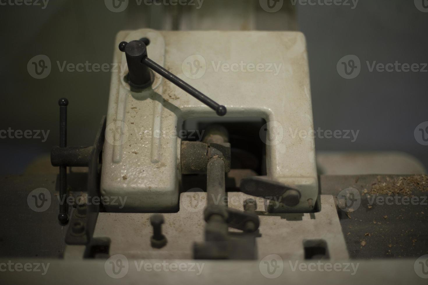 Iron lever mechanism. Old thing in garage. Steel block with lever. photo