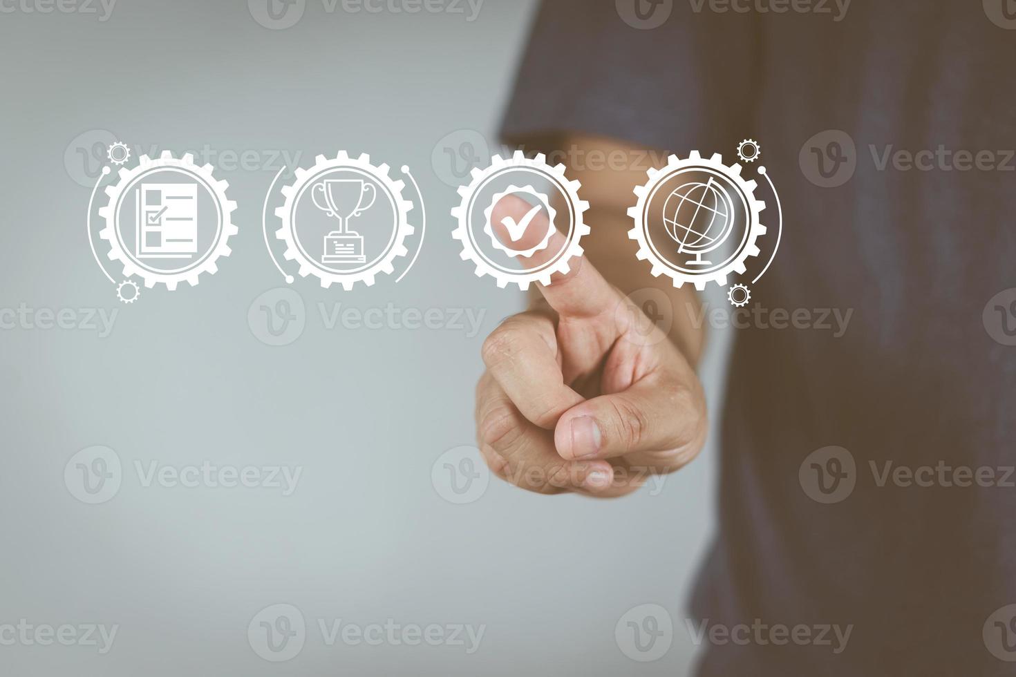 Quality and service assurance concept, men's hands are pointing to the quality and service assurance mark. to build confidence for customers photo