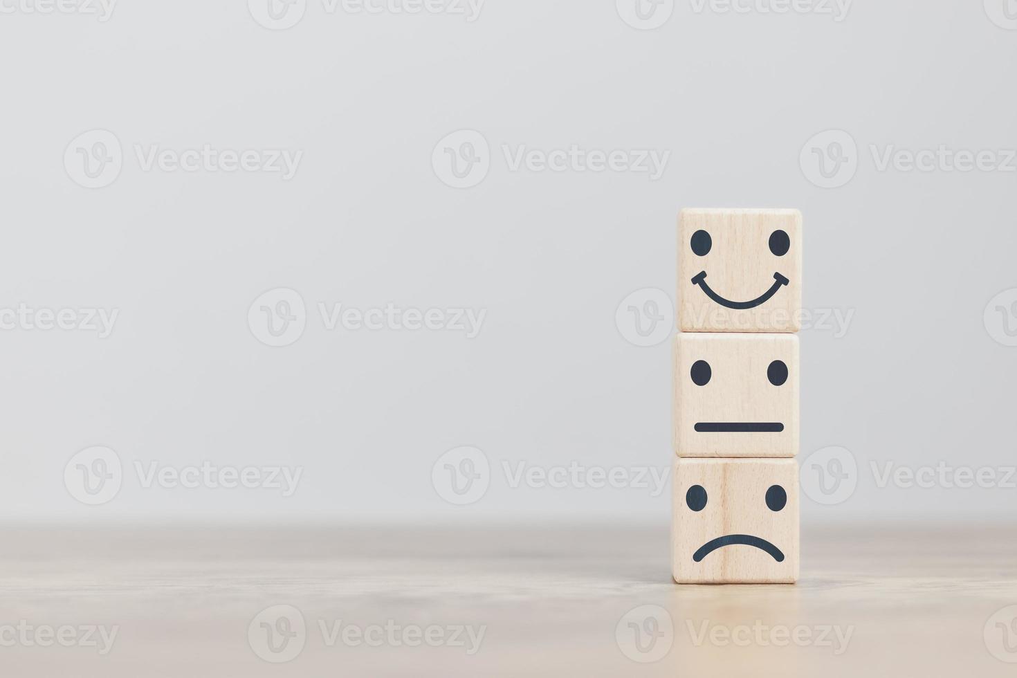 Customer service and Satisfaction concept a cube wood doing online assessments in the satisfaction rating the popular service company allows customers in order to improve and develop the organization photo