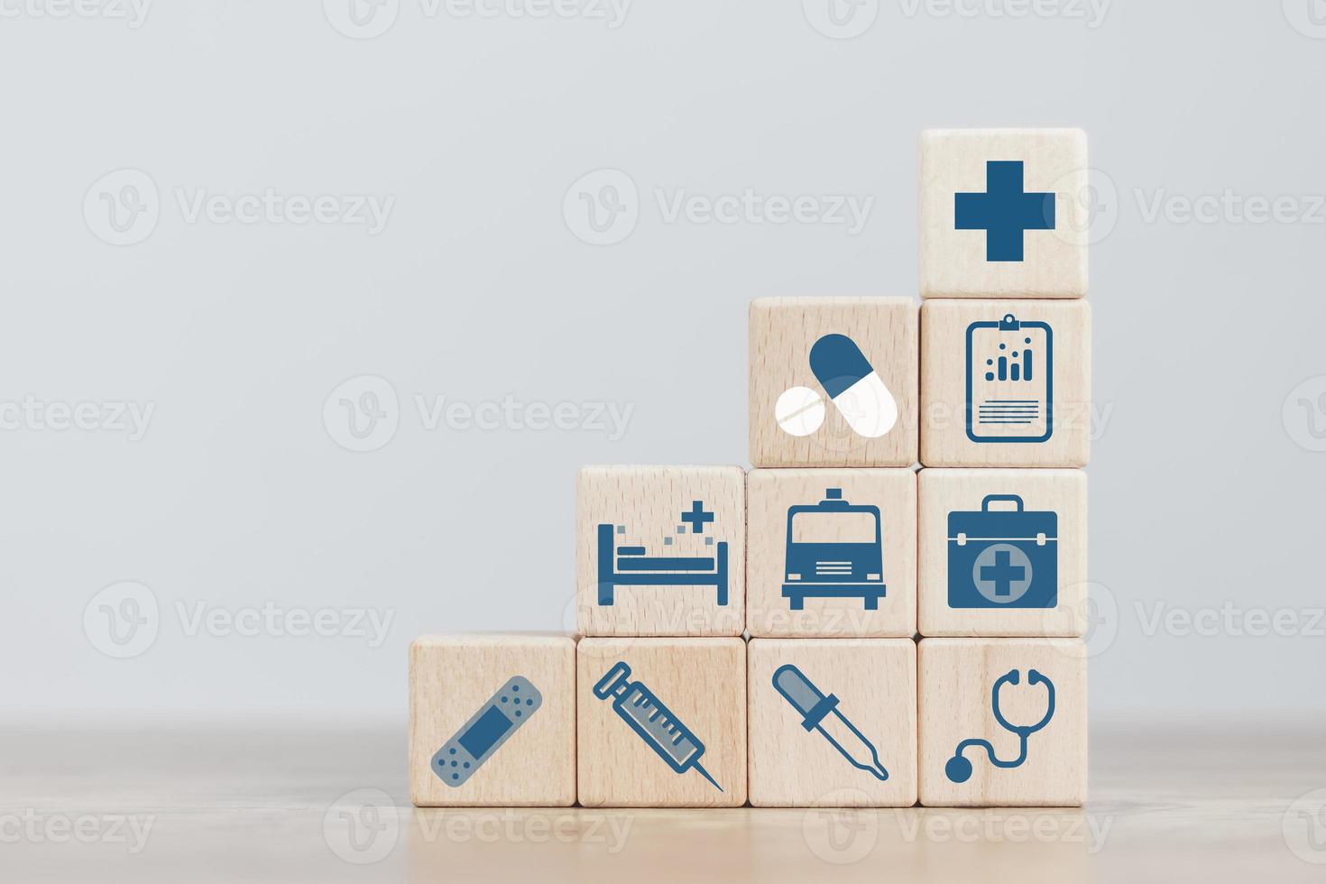 insurance concept, a man's hand is building a cube wood to show the decision about life insurance to plan the future for themselves and their families on money, health and tax breaks. photo