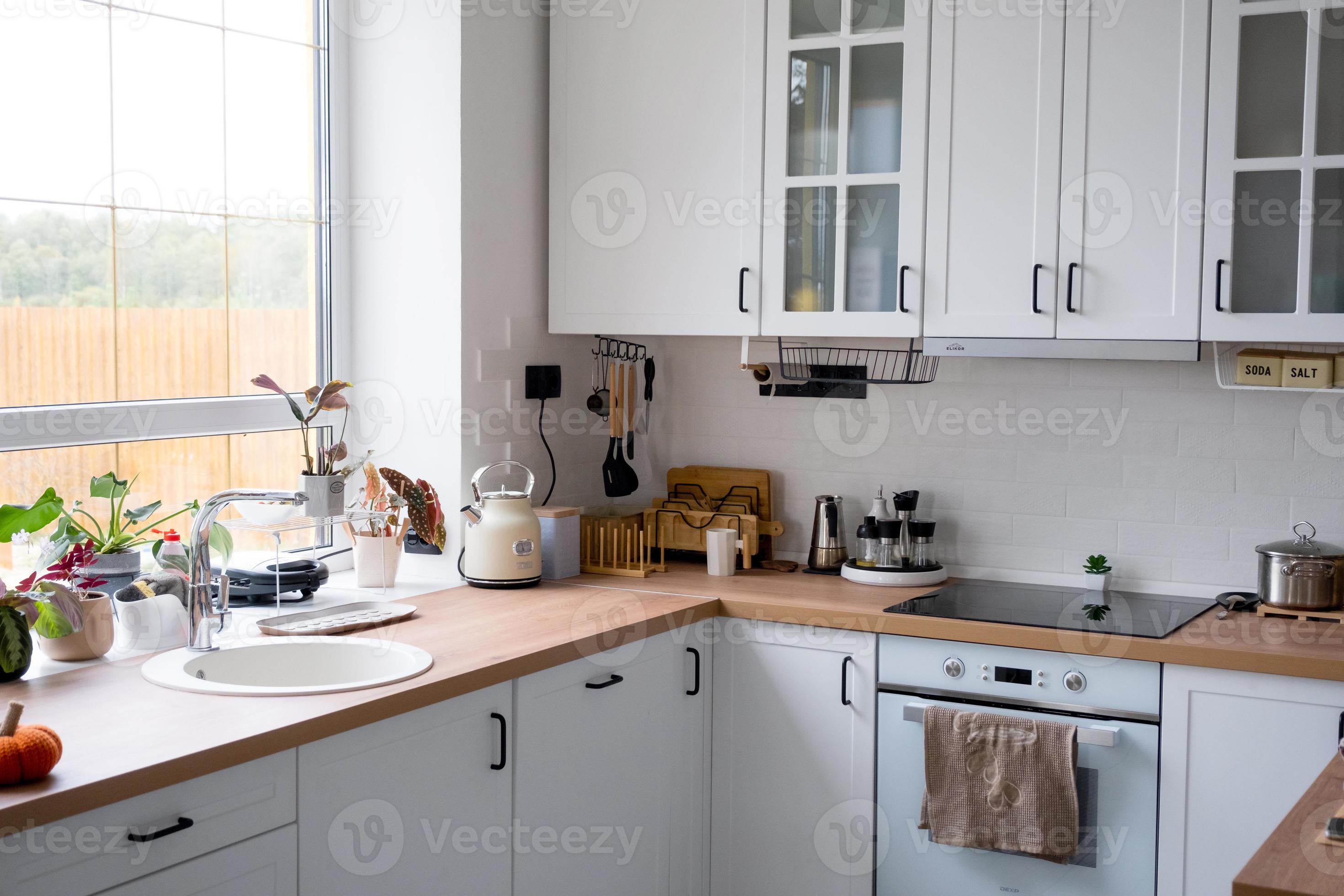 White cozy kitchen in Scandi loft style. Home interior, dining room