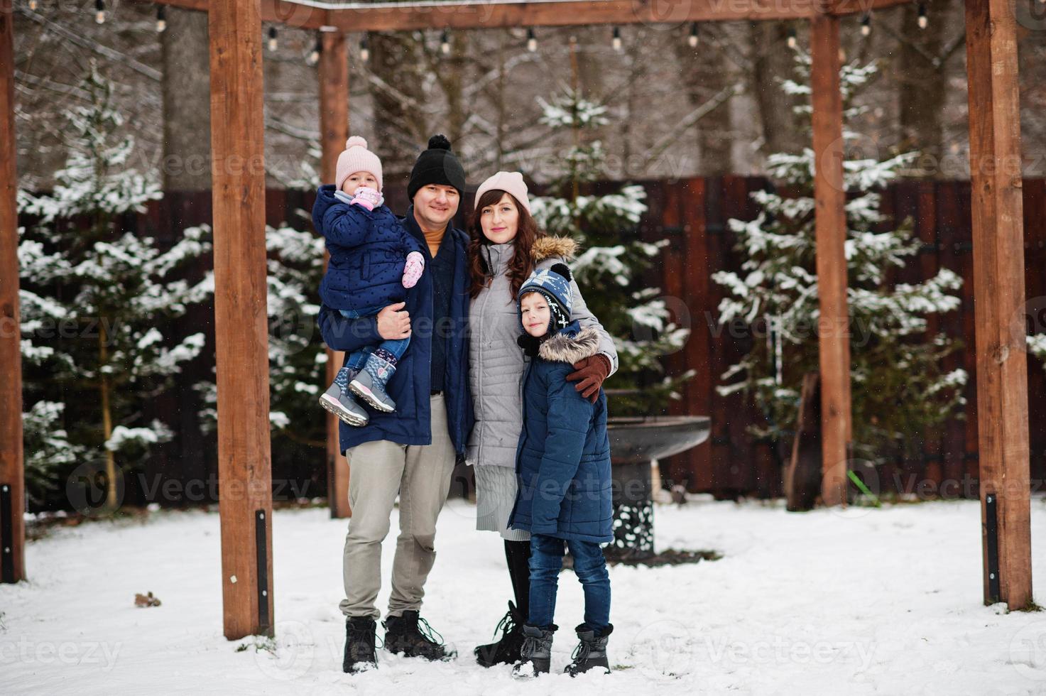 Young family with two kids in winter day. photo