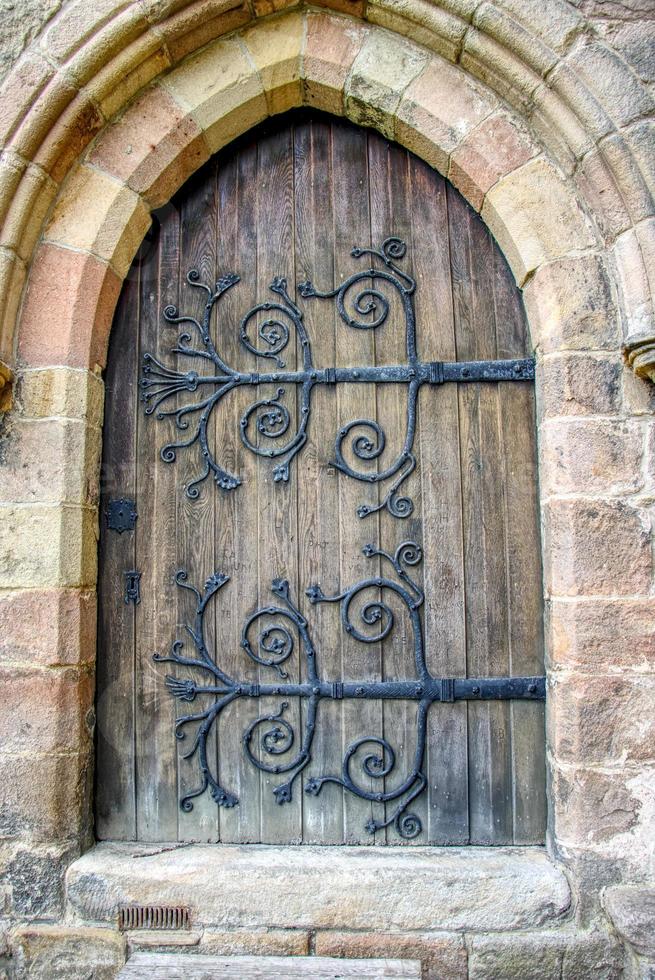 wooden abbey door with iron work photo