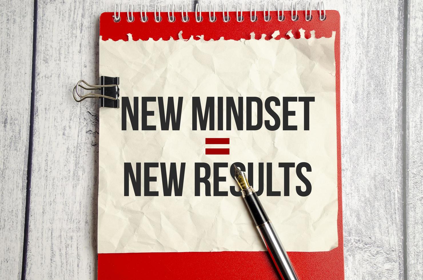 New Mindset - New Results on red notebook and wooden background photo