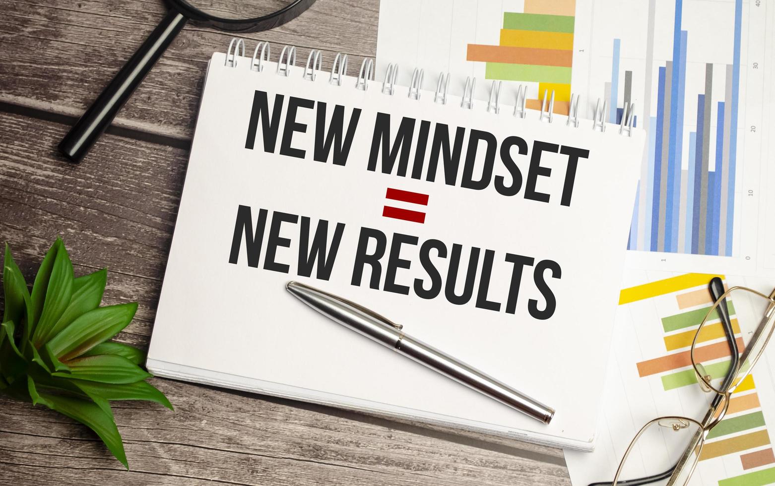 New Mindset - New Results on paper and charts with glasses photo