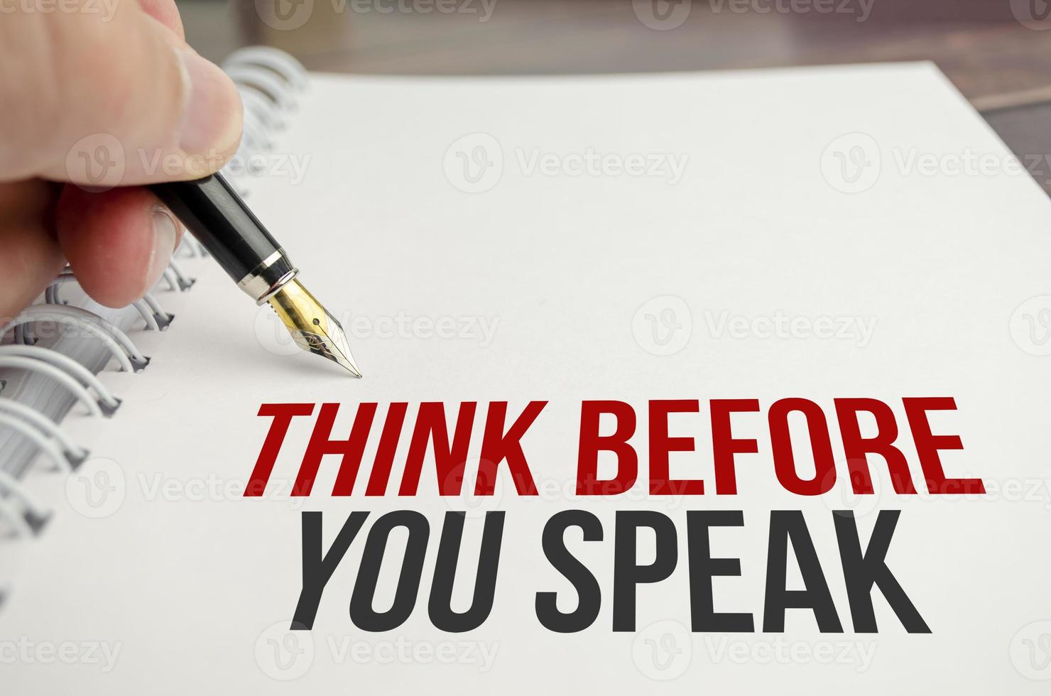 think before you think words on white paper and pen photo