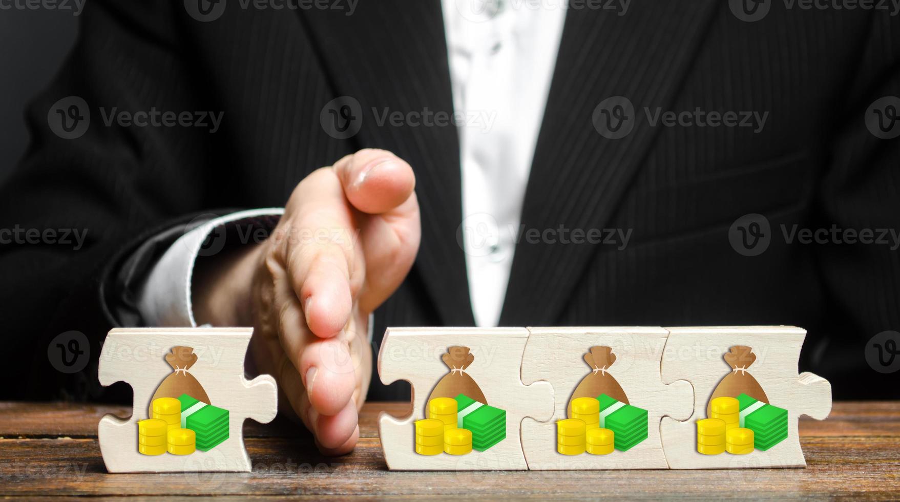 A businessman separates part of the money from the total. Payment of taxes and deductions. Corruption Kickback on orders, bribery. Financial management and distribution of funds. Saving and investing. photo