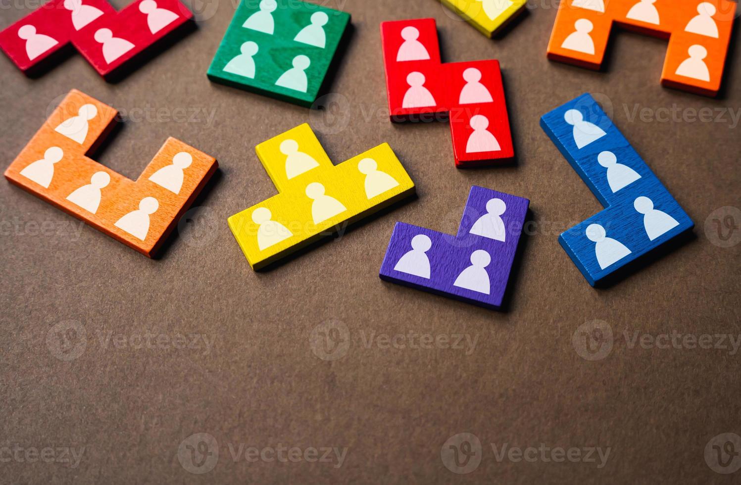 Puzzle pieces symbolizing people and workers. Work resources, employees. Hiring candidates. Society and social groups. Human resource management. Marketing and market segmentation. photo
