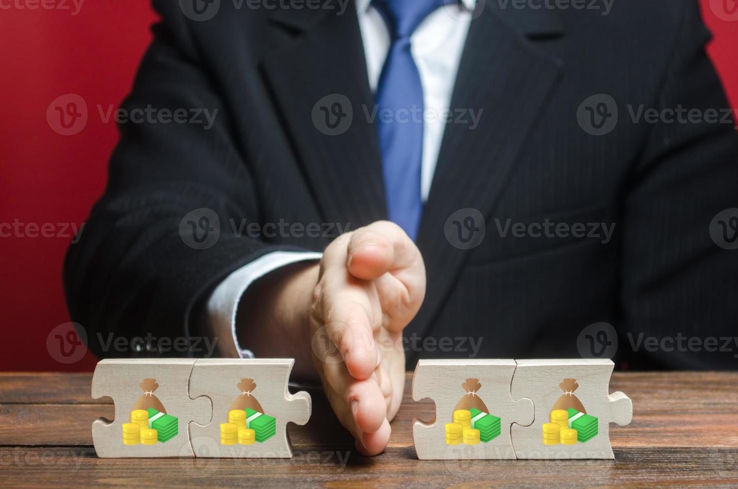 A businessman splits money into two equal parts. Distribution of funds. Saving, investing. Property business division. Divorce and legal services. Financial strategic budget management. photo