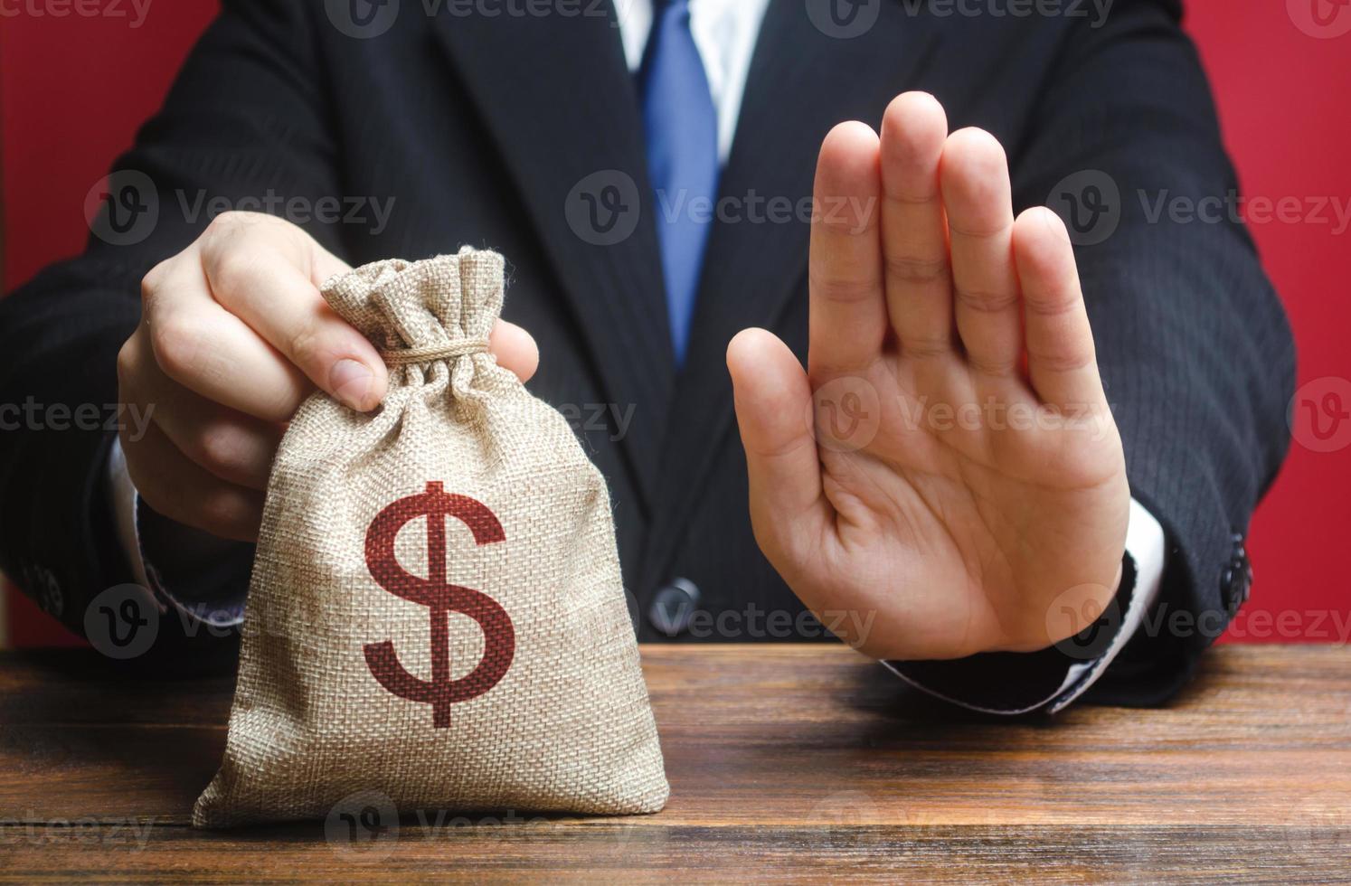 Businessman refuses to give a money bag. Refusal to grant loan mortgage, bad credit history. Refuses to cooperate. Economic sanctions, confiscation funds, deductions and fines. Financial difficulties photo