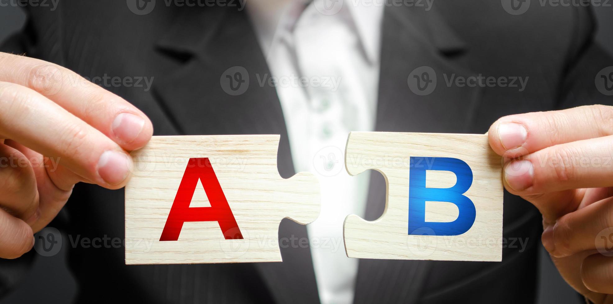 A man connects puzzles with the letters A and B. test marketing research method. multivariate testing. Improving products and services based on statistics and observations. Marketer photo
