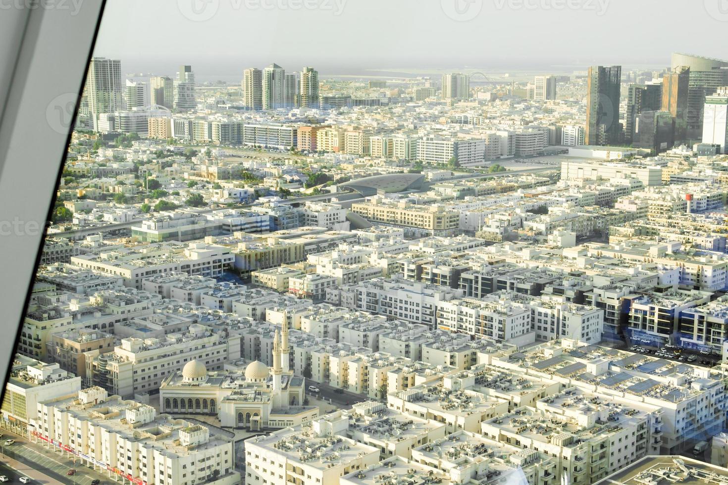 Panoramic view from top of Dubai Frame to old Dubai district and Al Rahma Masjid mosque. Travel in UAE and city old buildings photo
