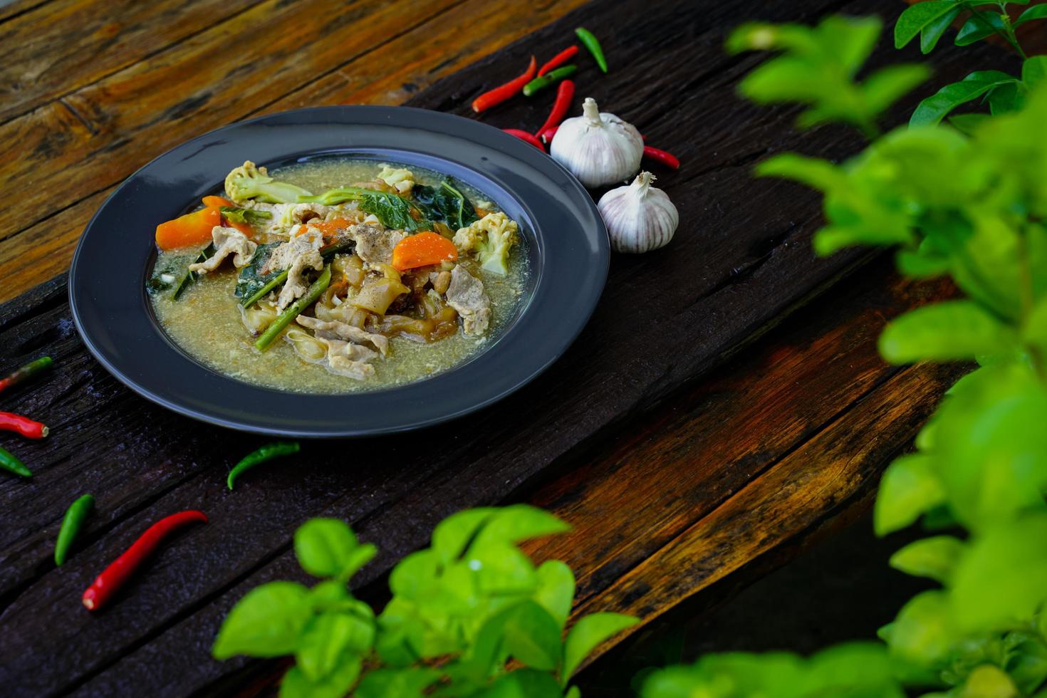 Stir Fried Noodles with Pork and Kale in Gravy  Chinese food and Thai food is popular to eat all over the country. photo