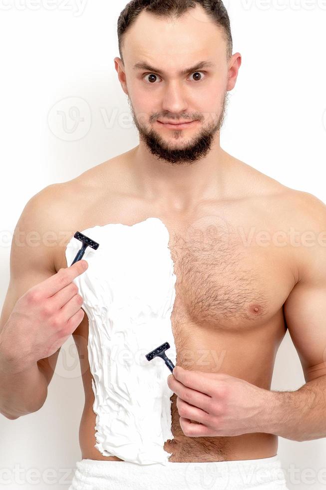 Young man shaving his chest 13850060 Stock Photo at Vecteezy