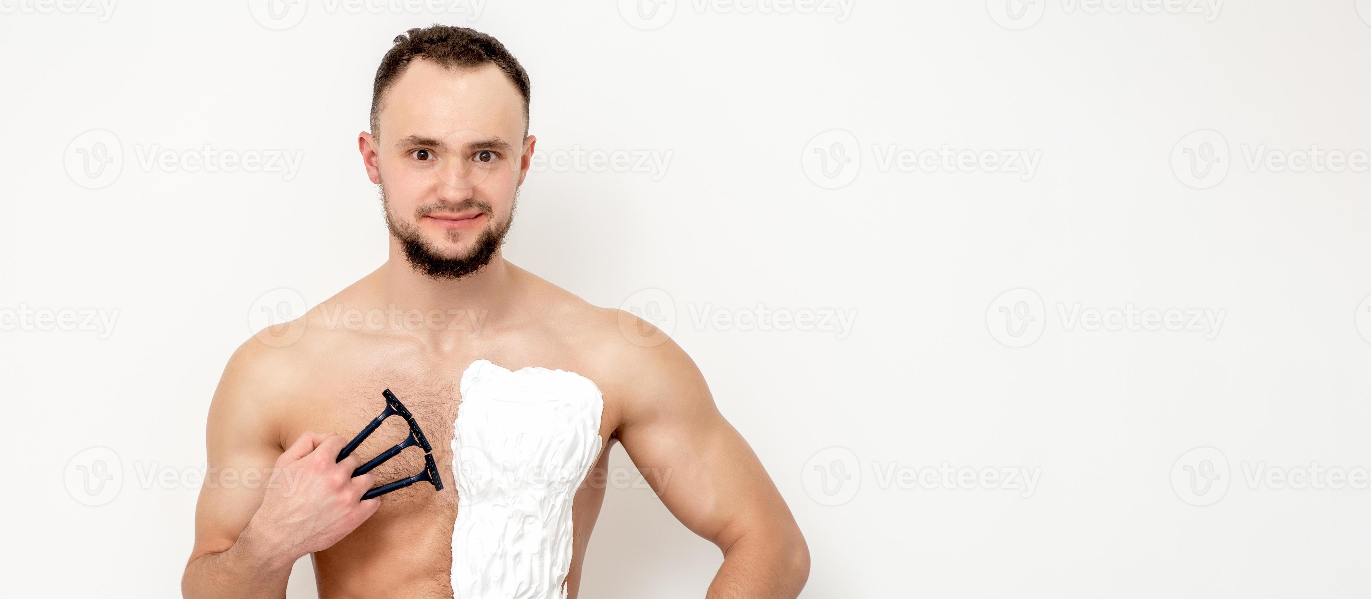 Young man shaving his chest 13850061 Stock Photo at Vecteezy