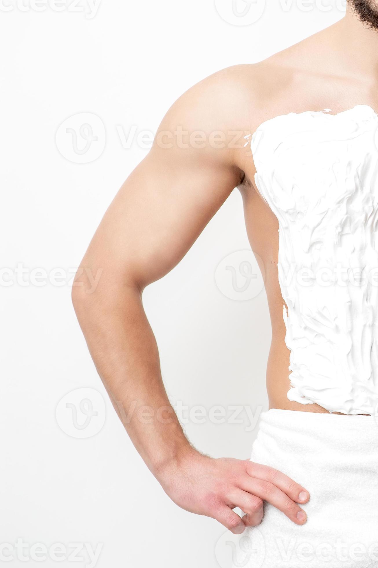 Young man shaving his chest 13850162 Stock Photo at Vecteezy