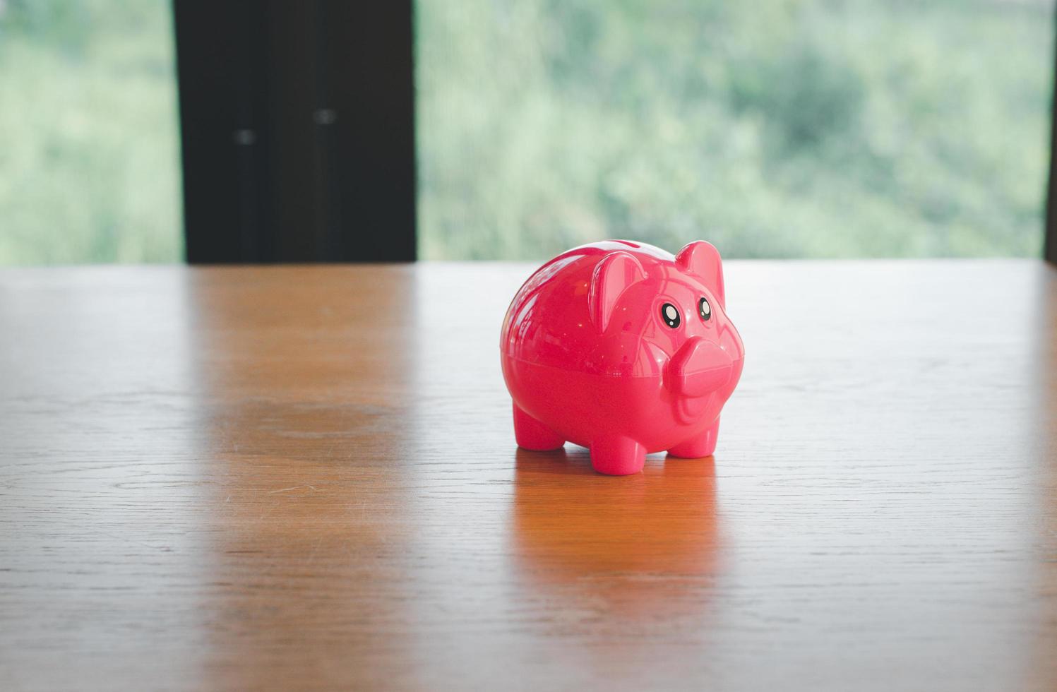 piggy bank on table with space photo