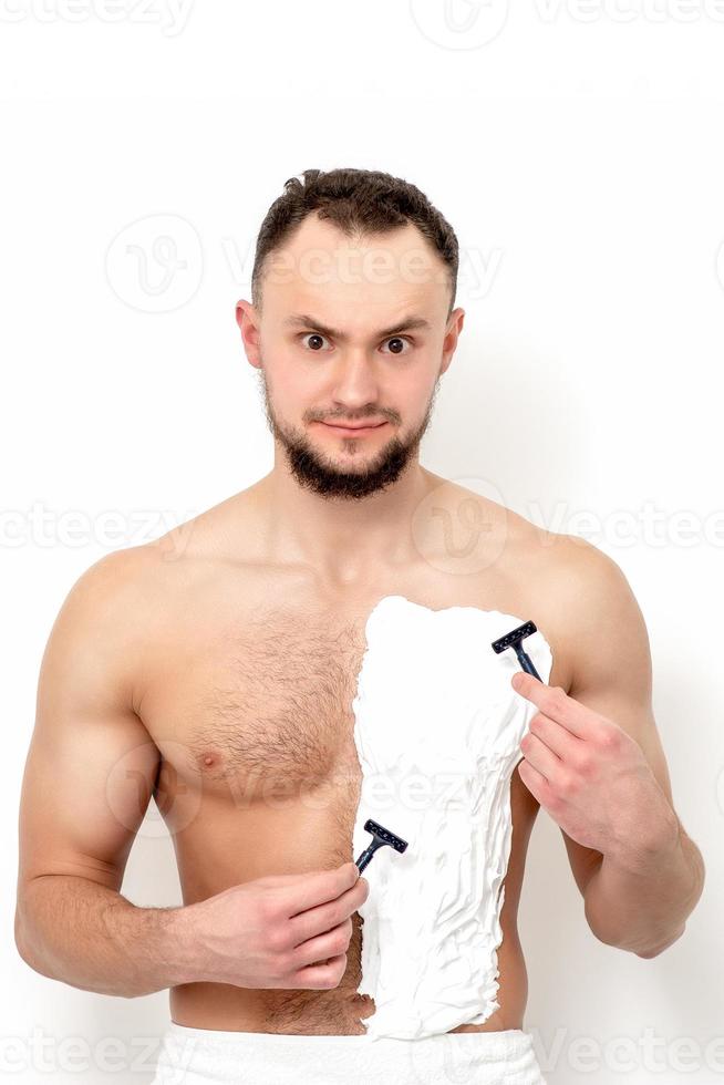 Young man shaving his chest 13850402 Stock Photo at Vecteezy