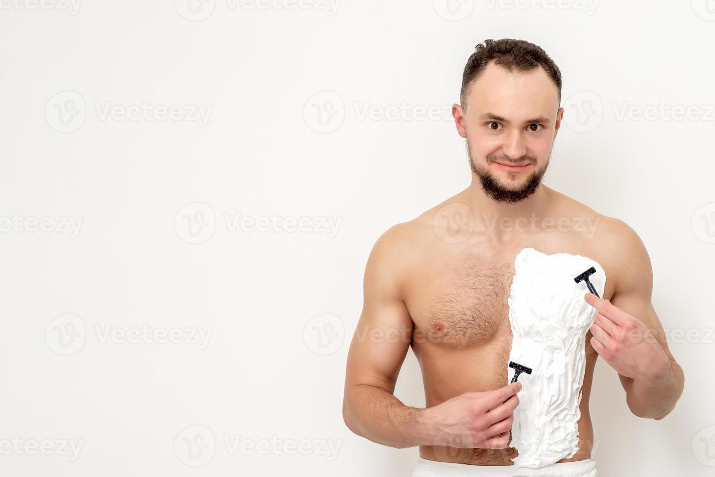 Young man shaving his chest 13850449 Stock Photo at Vecteezy