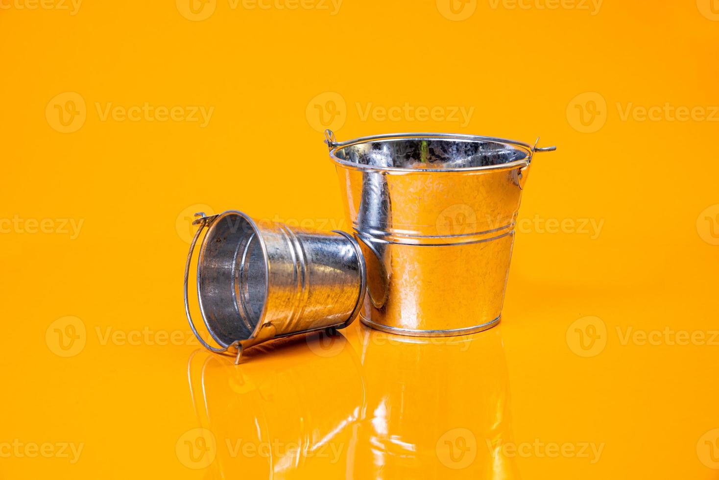 empty glass empty jar empty ice bucket on orange background photo