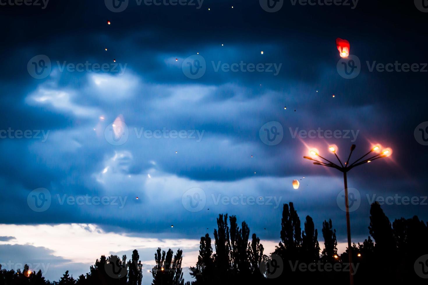 In the evening, at sunset, people with their relatives and friends launch traditional lanterns. photo