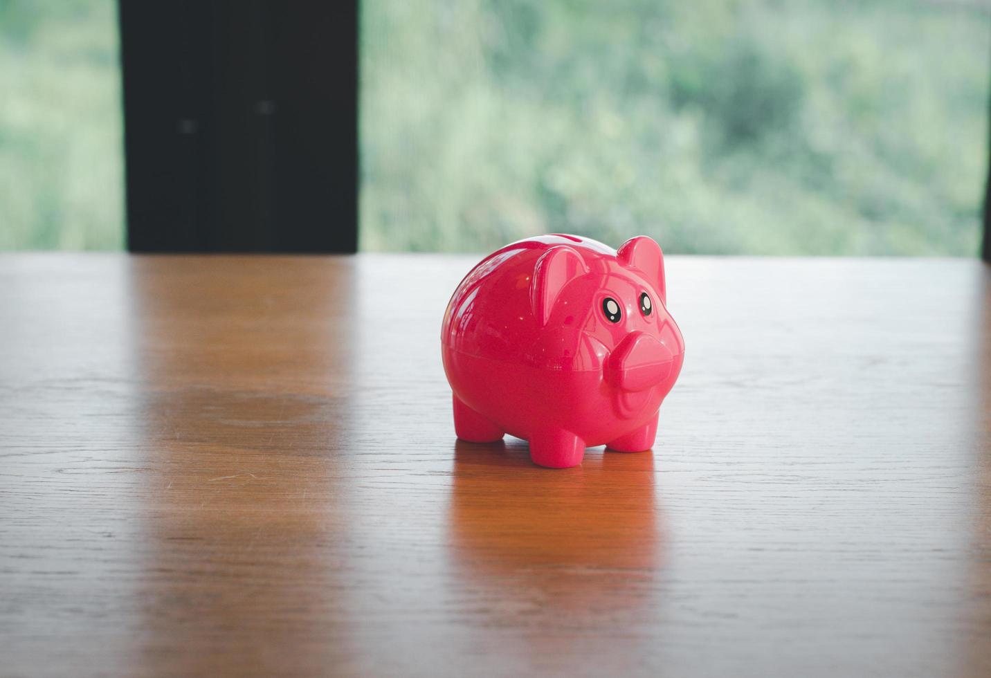 piggy bank on table with space photo