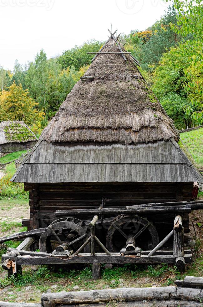 Old rural house with thatched roof photo