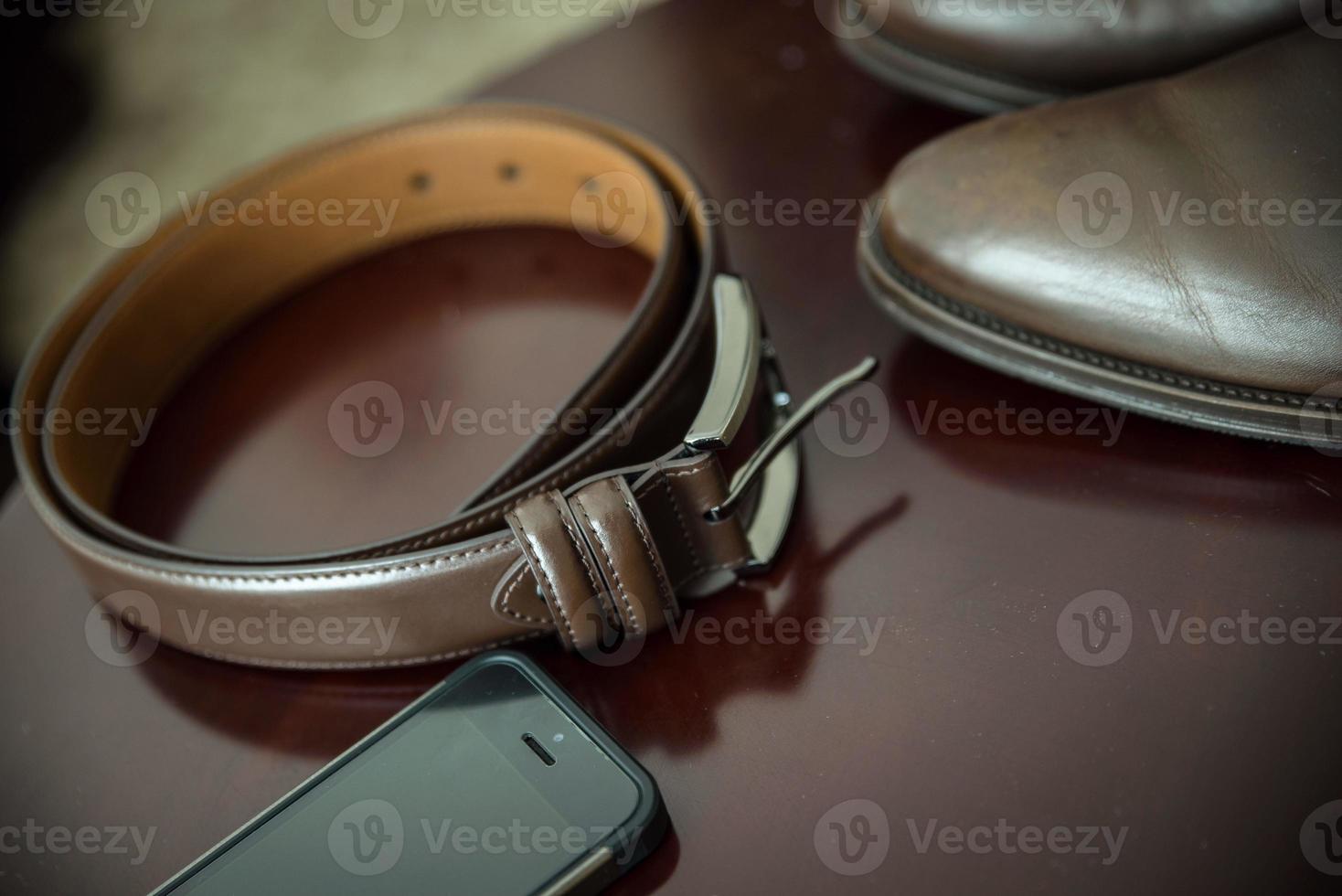 The groom's fees, jacket and watch photo