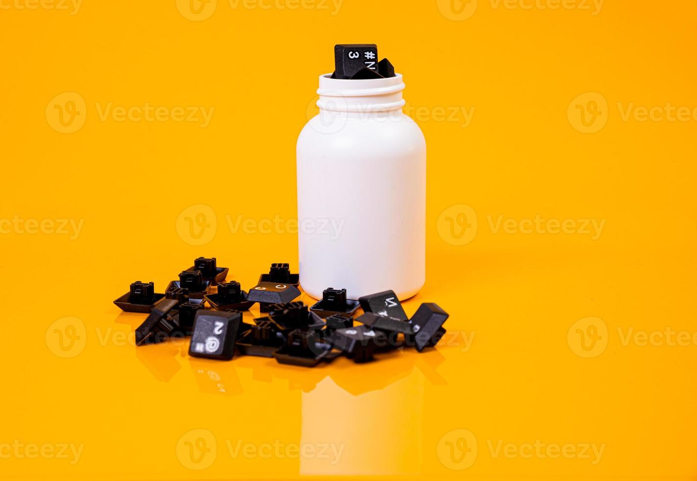 keyboard button in glass in jar in bucket on orange background photo