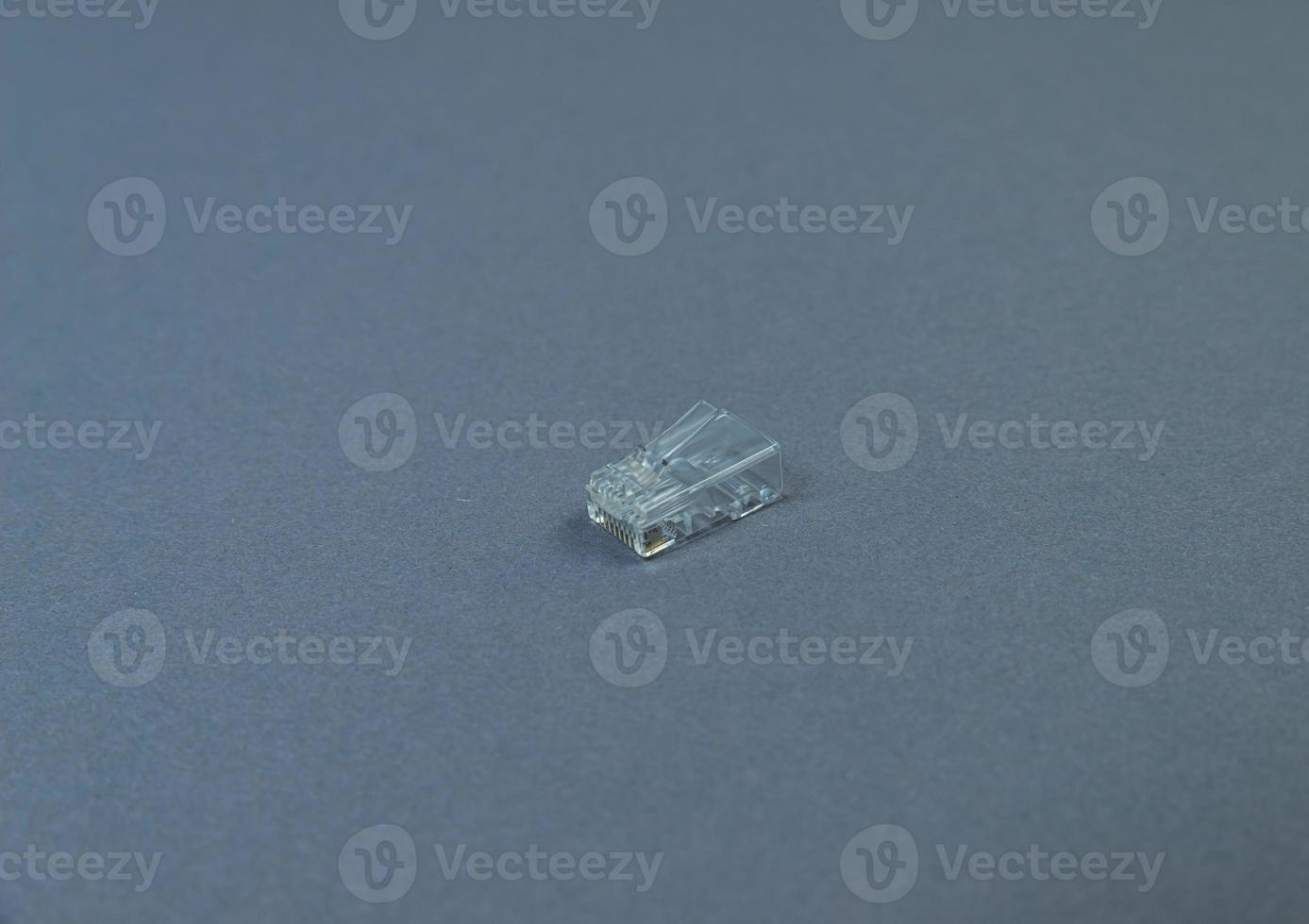 Connector rj-45 close-up on grey background isolate photo