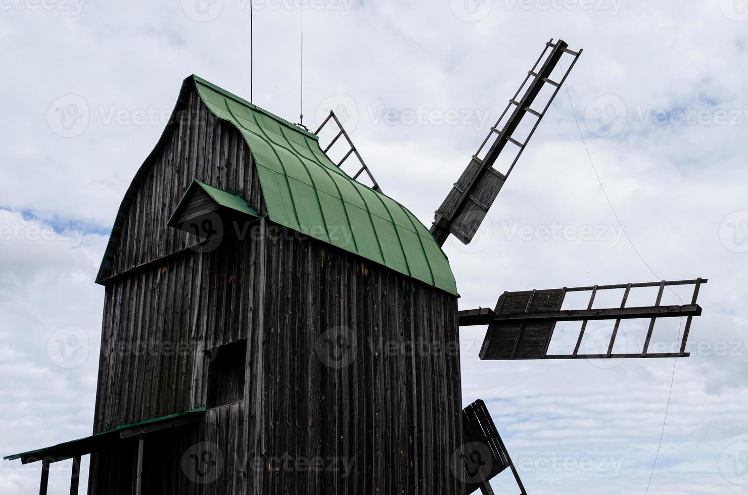 Summer landscape with an old wooden mill photo